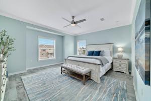 a bedroom with a bed and a ceiling fan at Carlinga Cottage at Lost Key Golf & Beach Club in Pensacola