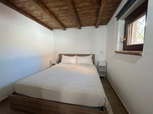 Кровать или кровати в номере Appartamento per Vacanze-Casa Sole