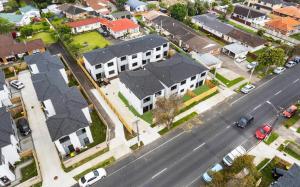 an aerial view of a neighborhood with houses and a street at Holiday Home at Huia Road in Auckland