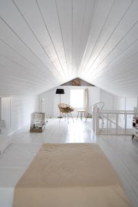A bed or beds in a room at Koukouapartments & Suites