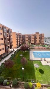 a courtyard with a swimming pool in a city at Ole Madrid Holiday Apartament IFEMA, Aeropuerto in Madrid
