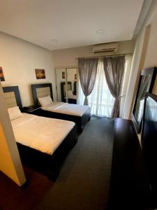 Postel nebo postele na pokoji v ubytování Dreams Suites