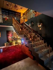 a spiral staircase in a room with a red carpet at 54 Street East near to F&F Tower in Panama City