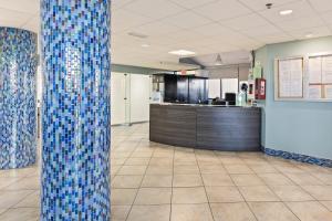 a lobby with a column in the middle of a room at Phoenix 5 Unit 1417 in Orange Beach +47 photos