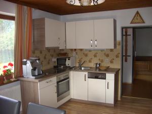 A kitchen or kitchenette at Haus Osterrieder