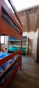 a bedroom with two bunk beds in a room at cabaña trafwe in Lago Ranco