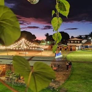 a view of a park at night with lights at Pousada Vila Jesuita in Cairu