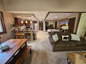 a living room with a couch and a table at Tamarron Gambel Oak 790 - Wild Turkey Ridge - Durango CO in Coffeyville