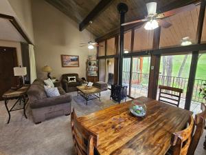 a living room with a large wooden table in a room at Tamarron Gambel Oak 790 - Wild Turkey Ridge - Durango CO in Coffeyville