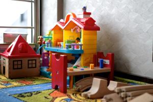 a toy room with a toy house and a playset at Willa Sara Karwia in Karwia