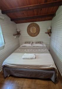 a bedroom with a large bed in a room at Chalet in Bazoches-sur-le-Betz
