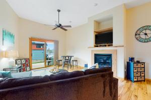 a living room with a couch and a fireplace at Lake Minocqua Lakeview in Minocqua