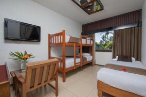 Ein Bett oder Betten in einem Zimmer der Unterkunft Fiji Gateway Hotel