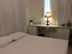 Una cama o camas en una habitación de Apartment in Nagua city center with parking 1-3 bedrooms and free WiFi