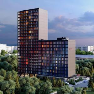 a tall building with a lot of windows at Aparthotel Hilton Blox in Tbilisi City