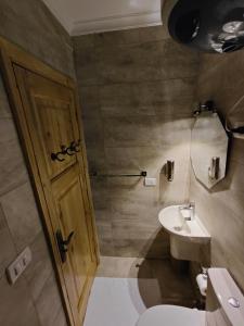 a bathroom with a toilet and a sink at Champollion Palace in Cairo