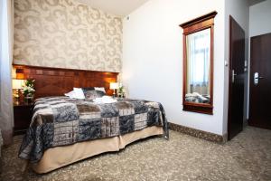 Posteľ alebo postele v izbe v ubytovaní Hotel Akvilon