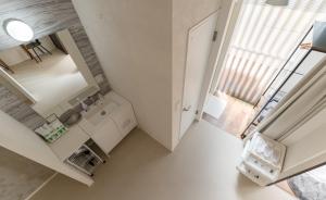 an overhead view of a white kitchen with a window at Flower Base Lily House - Vacation STAY 57830v in Fukuoka