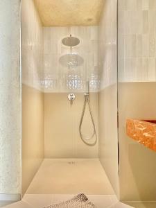 a walk in shower with a glass door at FUTURA ROOM&RELAX in Termoli +291 photos