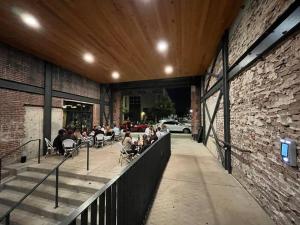 a group of people sitting in chairs in a building at Mercantile industrial loft! in Birmingham