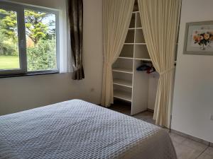 a bedroom with a bed and a window at Beautiful holiday location in Solís in Balneario Solís