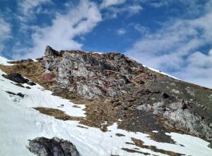 a rocky mountain with snow on top of it at FeWo D'Rock Arosa im Zentrum by Nature Apartments Switzerland in Arosa