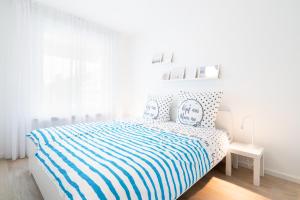 En eller flere senge i et værelse på Carpe Diem App 115