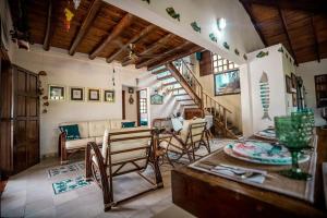 a living room with a couch and a table at ACUARELA in Trementino