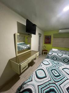 Cama o camas de una habitación en Hotel La Romana Center
