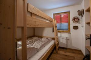 Postel nebo postele na pokoji v ubytování Haus Filzstein 136 Top 7