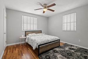 a bedroom with a bed and a ceiling fan at 1 Bedroom Unit in Hyde Park House in Tampa