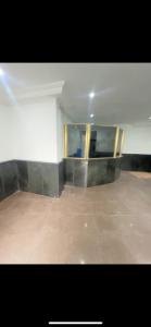 an empty room with a white wall and a floor at City Palace in Sao Paulo