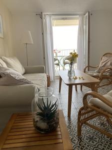 a living room with a couch and a table at Apartman Ratac 11 in Tučepi