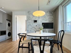 a kitchen and dining room with a table and chairs at Gudo Residence Chungmuro in Seoul