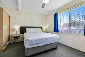 Postel nebo postele na pokoji v ubytování Comfort Inn on Main Hervey Bay + 25 fotografií