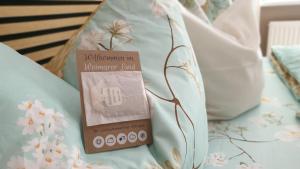 a book sitting on top of a bed at Ferienwohnung Sonnenschein Familie Hamdorf in Bad Sulza