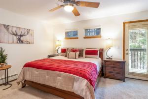 a bedroom with a bed and a ceiling fan at Cross Creek - Pool and Hot Tubs by Daniel in Frisco +29 photos