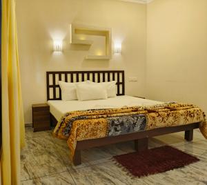 Postel nebo postele na pokoji v ubytování Marari Blue Waves