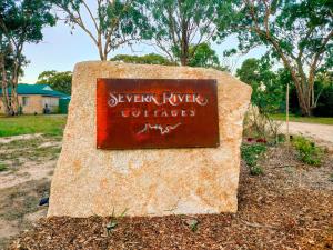 a sign for aevynyrk refugee coffees at Severn River Cottages in Severnlea