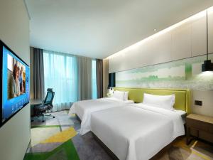 Телевизор и/или развлекательный центр в Hampton by Hilton Guangzhou Tianhe Sports Center-Free Shuttle Bus to Exhibition During Canton Fair Period