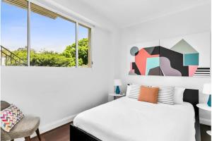 Ένα ή περισσότερα κρεβάτια σε δωμάτιο στο Bondi Beachfront Retreat - Beach views