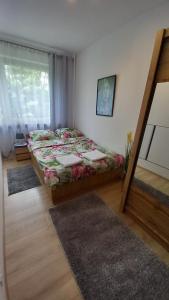 Posteľ alebo postele v izbe v ubytovaní MK Apartament IV