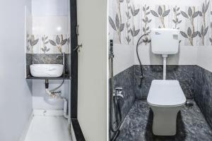 een badkamer met een toilet en een wastafel bij FabHotel Carnival I in Aurangabad