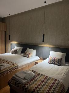 A bed or beds in a room at Old district