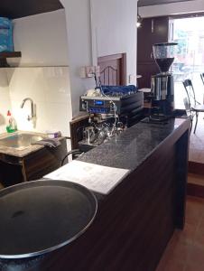 a kitchen with a counter top with a blender on it at Dalucha Heritage Home in Pātan