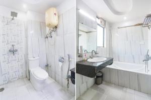 een badkamer met een toilet, een wastafel en een bad bij FabHotel Royal Ville in Patna
