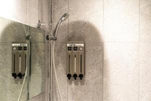 a shower in a bathroom with a glass door at Hotel May Yongsan in Seoul +50 photos