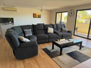 a living room with a couch and a coffee table at Cowell Townhouse apartments in Cowell +9 photos