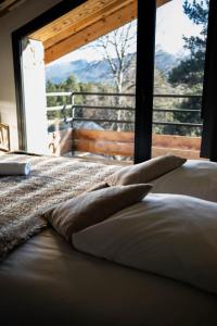 En eller flere senge i et værelse på Chalet Husky , Familliale, Calme, Spatieux