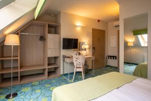 Postel nebo postele na pokoji v ubytování City Hotels Rūdninkai